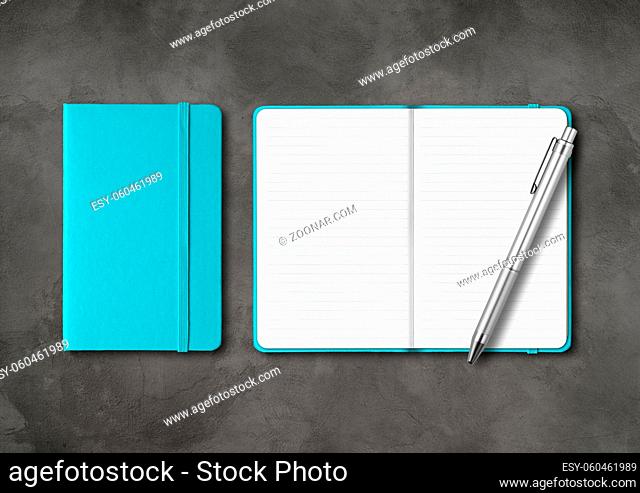Aqua blue closed and open lined notebooks with a pen. Mockup isolated on dark concrete background
