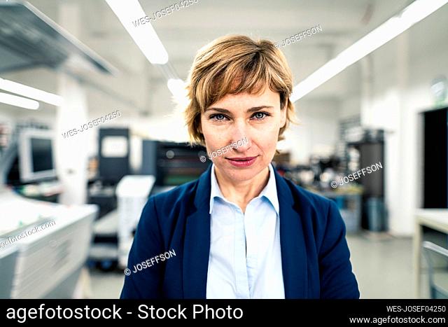 Female entrepreneur staring in workshop