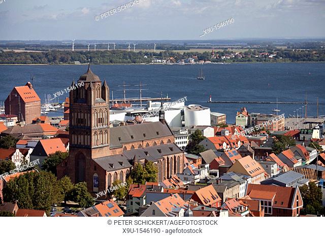 view over the historic centre of Stralsund with Saint James's Church, Ozeaneum and Ruegen island, Hanseatic City of Stralsund, Mecklenburg-Vorpommern, Germany