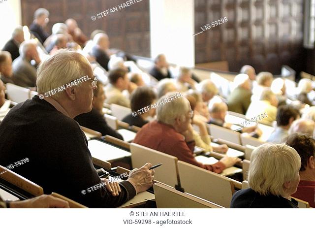 Senior citizens during a lecture for elderly people in an auditorium of the University Hamburg. - HAMBURG, GERMANY, 20/04/2004