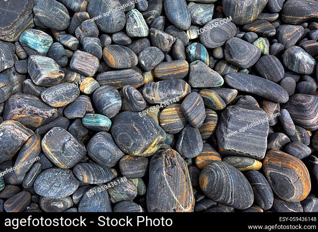 Gray striped pebble as a background