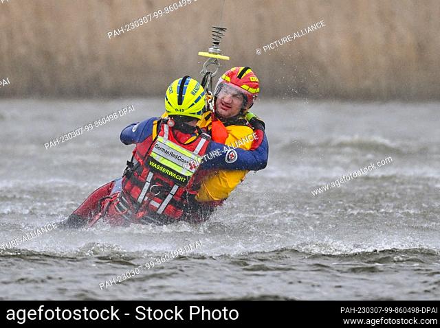 07 March 2023, Brandenburg, Frankfurt (Oder): During a water rescue exercise, two people are pulled from the German-Polish border river Oder by a Bundeswehr...
