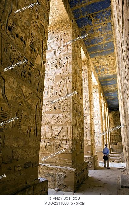 Painted carvings of hieroglyphs and figures at Medinet Habu Mortuary Temple of Ramses III aka The Ramesseum. West Bank Luxor Egypt