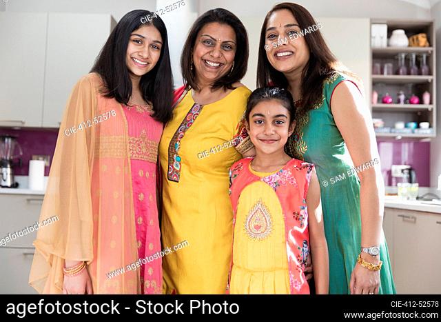 Portrait happy multigenerational Indian women in traditional saris