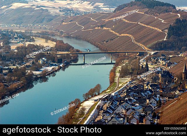 View on the valley of the river Moselle and the wine villages Mülheim and Lieser, Germany in winter with snow