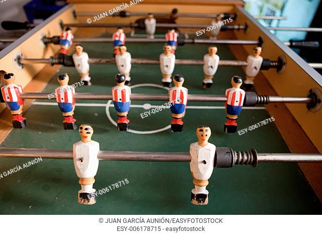A table for table football in the pub, visible figures of toy mini football players
