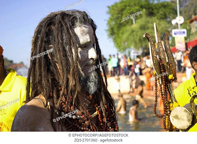 Naga sadhu with long hair and face ash. Kumbh Mela 2016. Ujjain, Madhya Pradesh, India