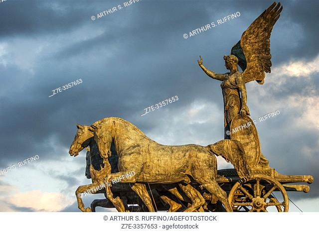 Statue of Goddess Victoria on a Quadriga (Winged Victory Statue) at sunset. Victor Emmanuel II Monument (Monumento Nazionale a Vittorio Emanuele II)