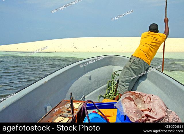 white sand dune and boatman, Unguja island, Kizimkazi, Zanzibar