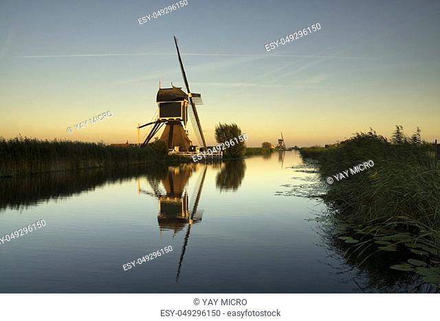 Windmill the Gelkenesmolen along the Ammersche Boezem canal near the Dutch village Groot-Ammers