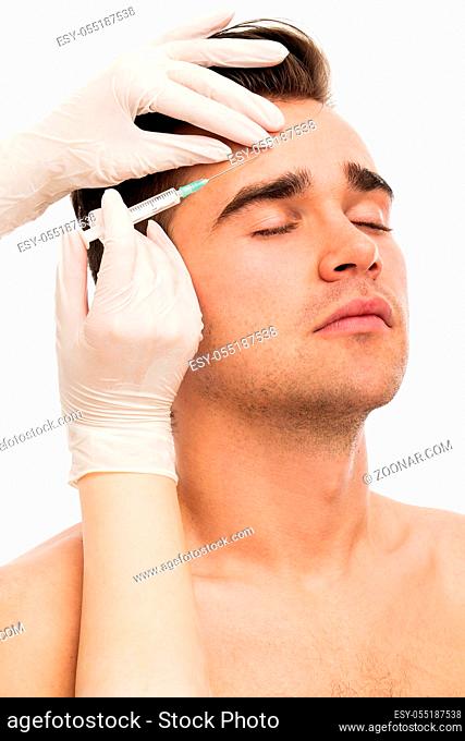 Plastic surgery. Handsome man on a white background