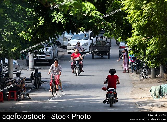 MYANMAR, MANDALAY - OCTOBER 25, 2023: Traffic in a street. Yuri Smityuk/TASS