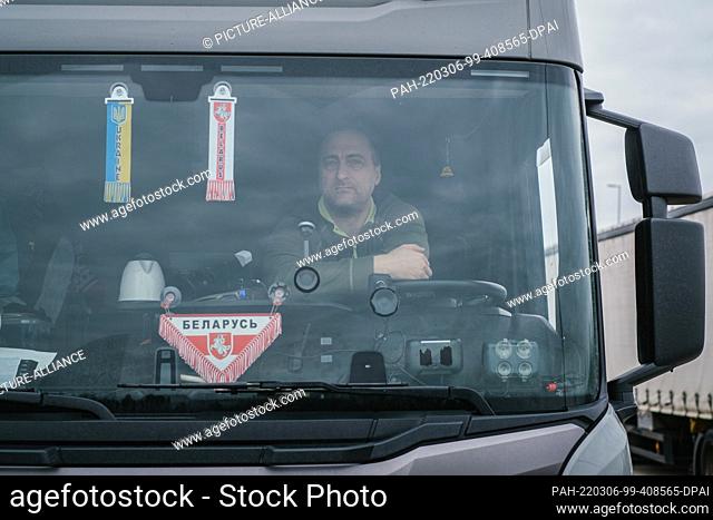 06 March 2022, Lower Saxony, Lehrte: Truck driver Petr from Belarus is sitting in his truck on A2 highway service area Lehrte