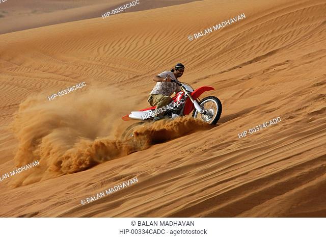 A DIRT BIKE AT THE DESERT SAFARI IN DUBAI