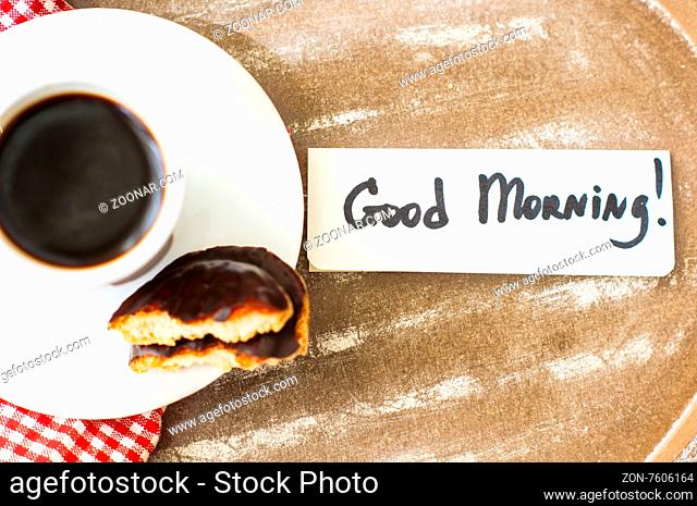 Cup of black coffee and Good morning note