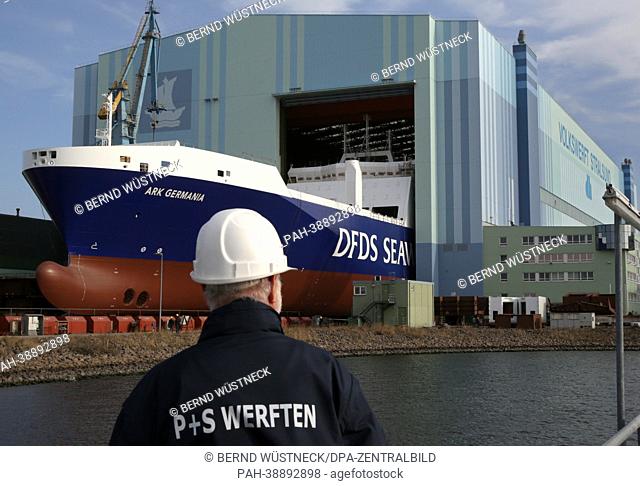 The first of two cargo ships for the Danish shipping company DFDS (L) is rolled out of the shipyard of bankrupt shipbuilding company P+S in Stralsund, Germany
