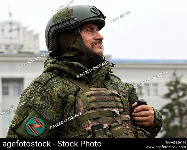 RUSSIA, ZAPOROZHYE REGION - DECEMBER 19, 2023: A serviceman is seen in a street in the city of Berdyansk. Alexei Konovalov/TASS