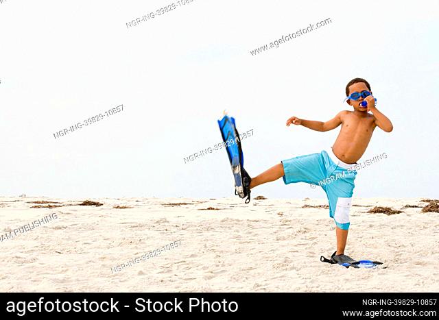 Boy wearing snorkel and flippers
