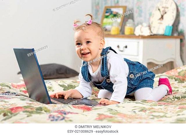 Sweet baby with laptop