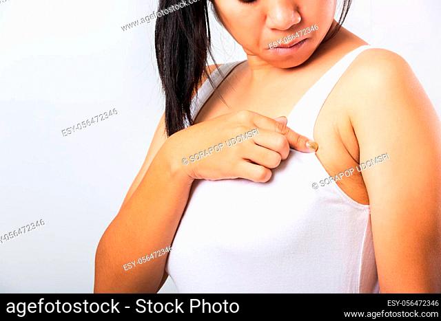Close up of Asian woman pointing her skin underarm she problem armpit fat underarm wrinkled skin, problem armpit skin, studio isolated on white background