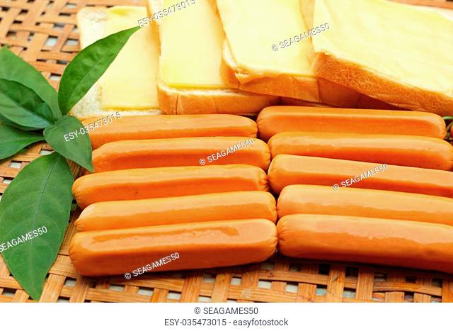 cheese the place on a slice of bread and sausage