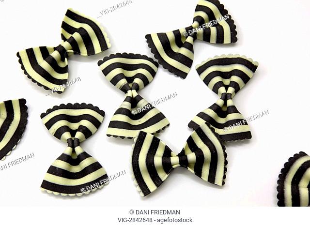 Black and white striped farfalle (bowtie) pasta. The distinct black stripe colour of the pasta is derived from squid ink which is a known Italian delicacy