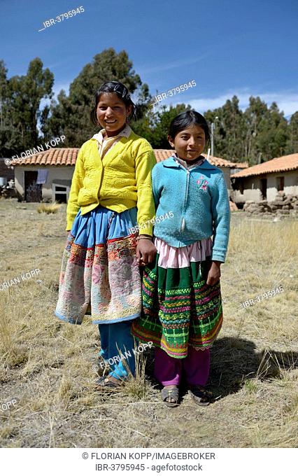Two pupils of the primary school, in traditional colorful clothes of the Quechua, Union Potrero, Quispillacta, Ayacucho, Peru