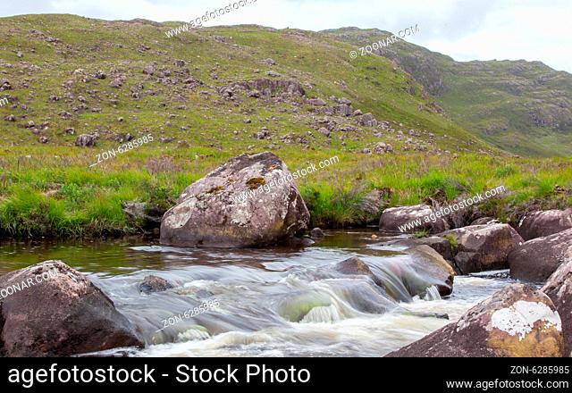 Landscape with waterfall in the mountains, Scotland