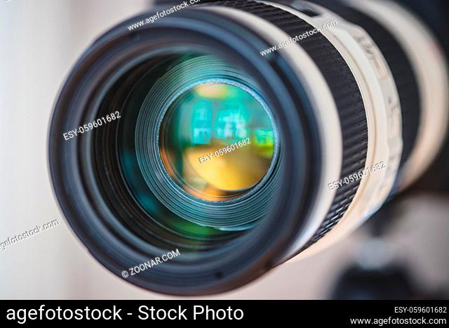 Close up of professional photo camera on a tripod, lens
