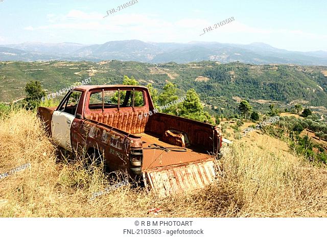 Abandoned car in field, Peloponnese, Greece