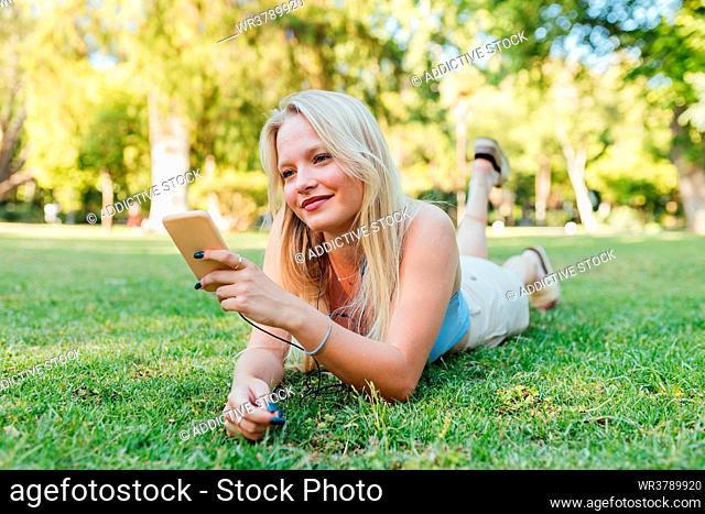 young woman, mobile communication, park, summer, relax