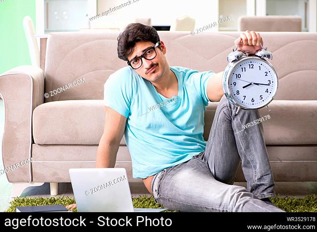 Student preparing for university exams at home in time management concept