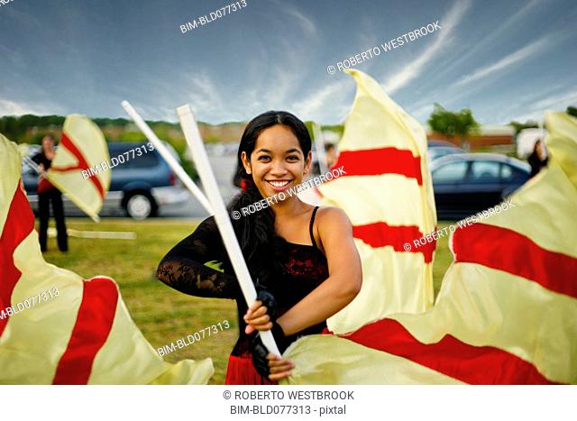 Pacific Islander girl flag twirling
