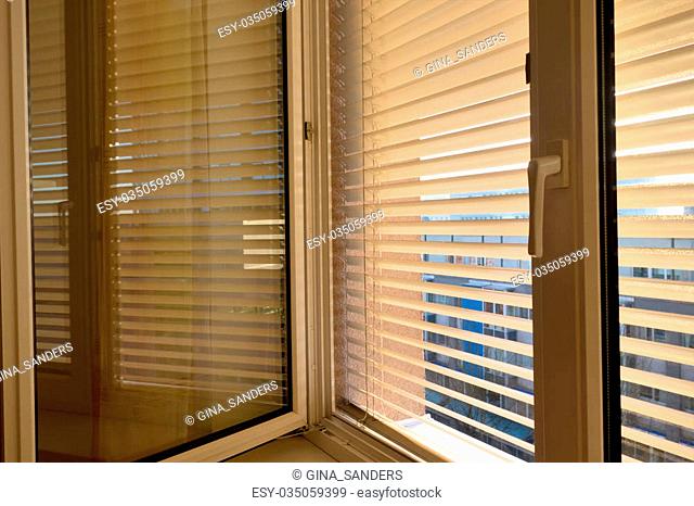 to protect against heat and sun blinds are attached to a window