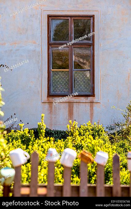 Old farm building and dwelling house, climbing roses and flowers, picturesque windows and doors it is a romantic corner near Milotice Castle, South Moravia