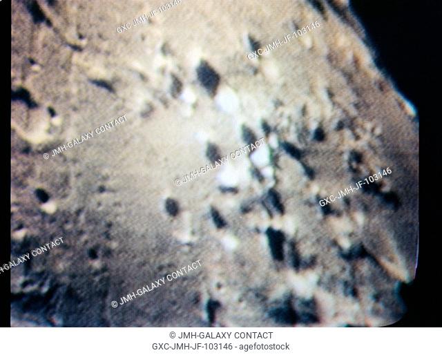 The crater Gutenberg area on the lunar nearside is seen in this color reproduction taken from a telecast made by the color television camera aboard the Apollo...