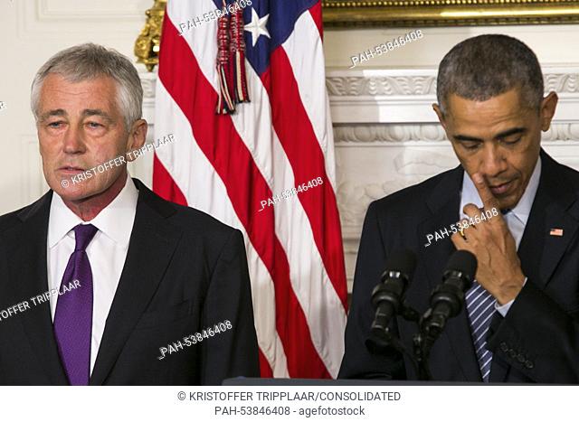 United States President Barack Obama, right, announces the resignation of Secretary of Defense Chuck Hagel, left, in the State Dining Room of the White House in...