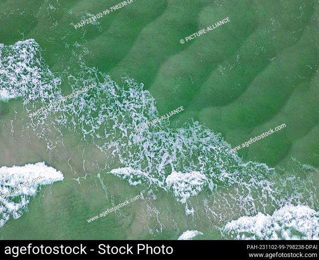 28 October 2023, Denmark, Dueodde: The Baltic Sea off Dueodde on the southeastern tip of the Danish Baltic Sea island of Bornholm (aerial view taken by a drone)