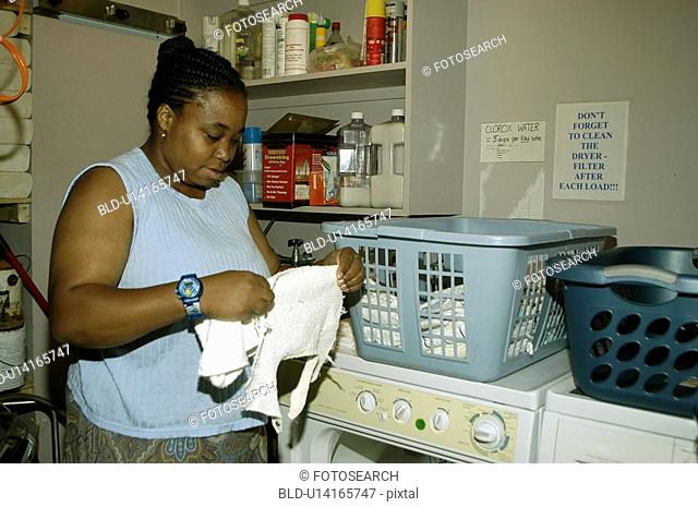 Woman working in a laundry room