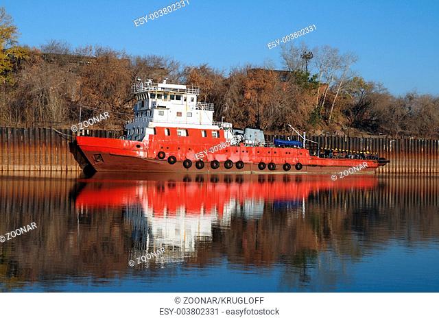 Tugboat docked in the backwater