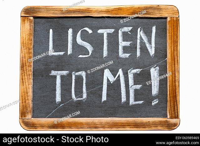 listen to me exclamation handwritten on vintage school slate board isolated on white