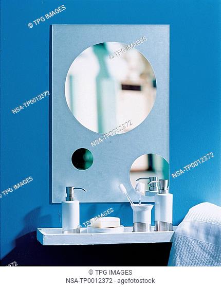 Soap dispenser and toothbrush holder in the bathroom