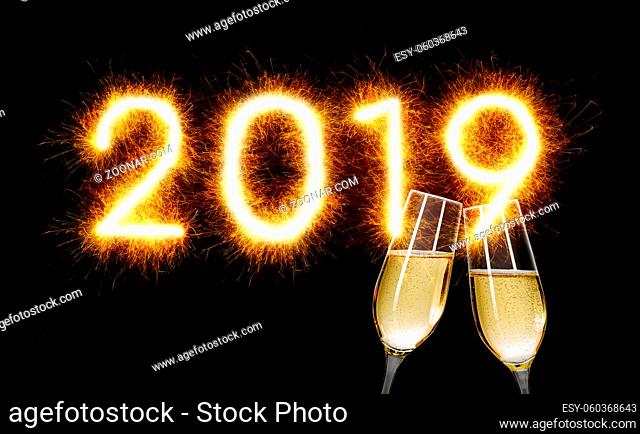 Sparkler with champagne glasses - Happy New Year 2019