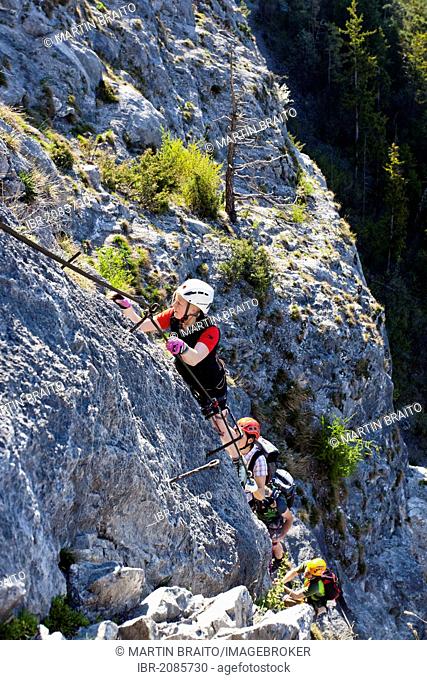 Climbers during the ascent of the Kaiser-Max fixed rope route in Martinswand near Innsbruck, North Tyrol, Tyrol, Austria, Europe