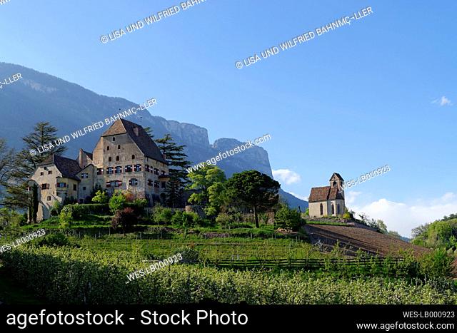 Italy, South Tyrol, South Tyrolean Unterland, Eppan, Fruit glove at the Castle Englar, with Castle Church Saint Sebastian