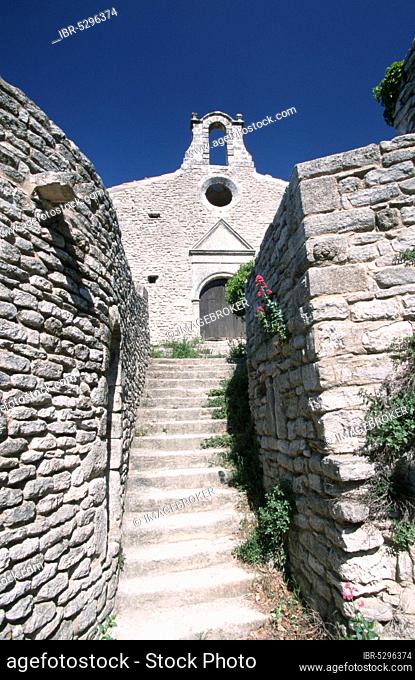 Old church and stone walls, Saignon near Apt, Provence, Southern France