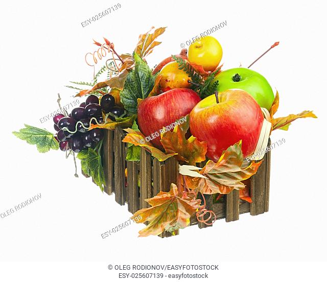 Composition from Artificial Fruits and Autumn Leaves in Wooden Box Isolated on White Background. Closeup
