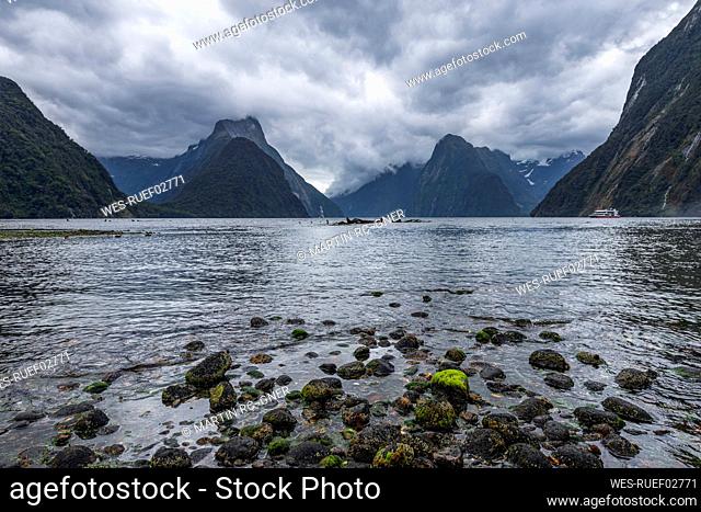 New Zealand, Southland, Storm clouds over scenic coastline of Milford Sound