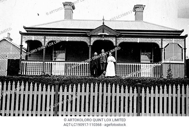 Negative - Warrnambool, Victoria, circa 1920, The Duffus family on the verandah of their home. It is a substantial weatherboard house with a verandah with iron...