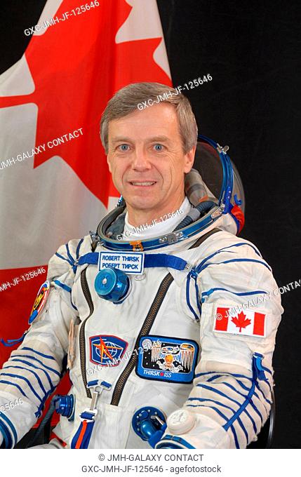 Canadian Space Agency astronaut Robert Thirsk, Expedition 2021 flight engineer, attired in a Russian Sokol launch and entry suit